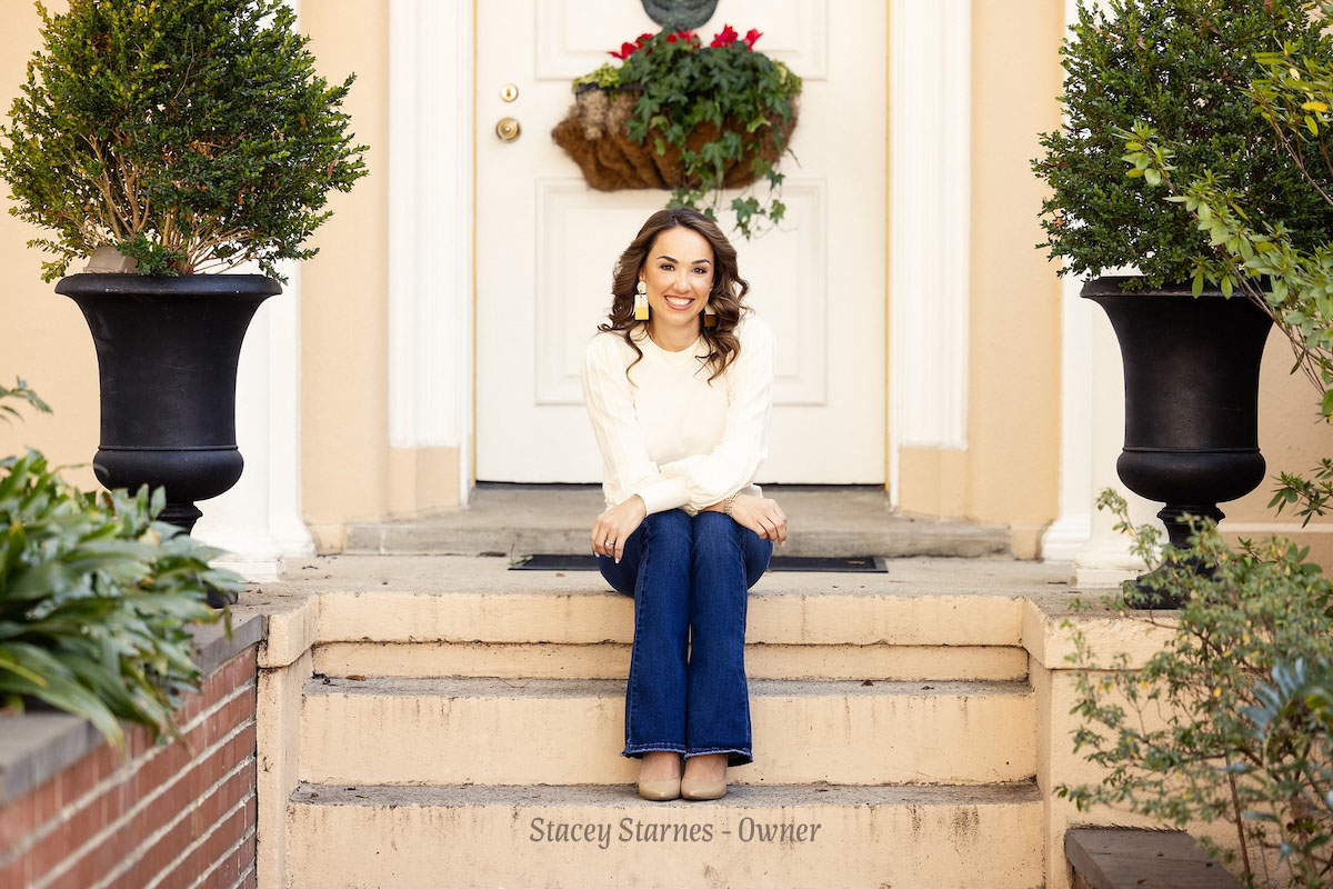 Stacey Starnes standing at the entrance of Real Estate School for Success