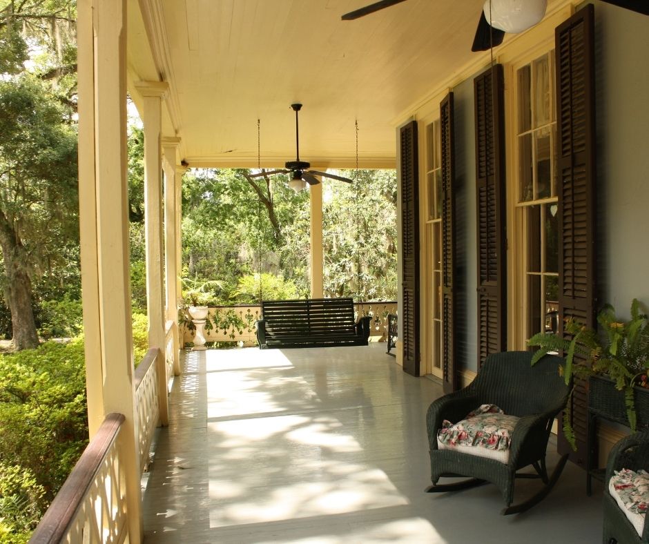 Real estate for sale sign in front of suburban home