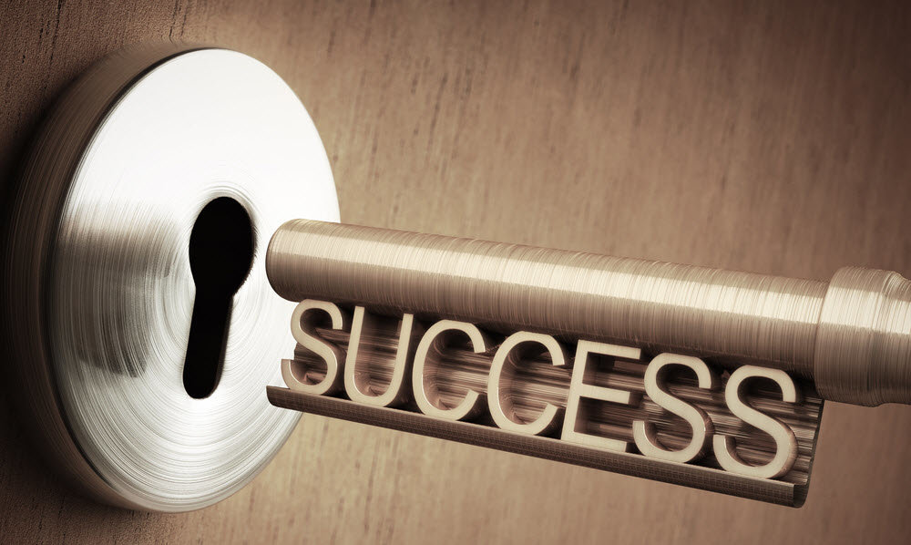 Happy couple receiving keys to their new home