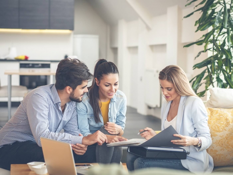Agent and client shaking hands after closing a deal